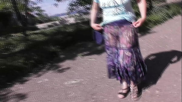 Mature Seductress in See-Through Dress Tease